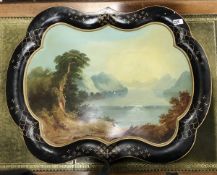 A 19th Century painted Toleware tea tray with figure seated in foreground,
