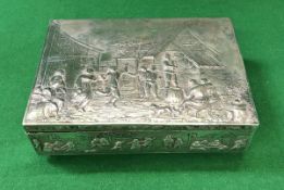 An early 20th Century Dutch silver and embossed rectangular box decorated with figures merry-making