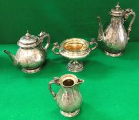 A Victorian silver four piece tea set in the Chinese style,