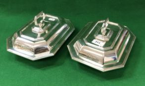 A pair of George V silver vegetable tureens of rectangular form with faceted corners and reeded