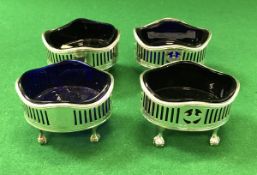 A set of four George III silver salts with pierced and urn decoration and beaded rims,