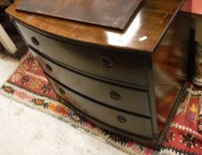 A modern mahogany bow fronted chest of three drawers,