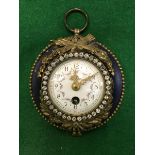 A 19th Century French hanging clock with gilt mounts on a painted blue body,