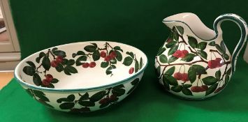 A Wemyss "Cherry" pattern toilet jug and bowl, the jug stamped "T & Co.