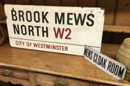 A vintage enamel road sign inscribed "Brooke Mews North W2 City of Westminster"