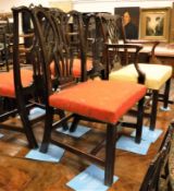 A set of twelve 19th Century mahogany framed Chippendale style dining chairs with pierced and