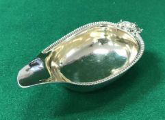 A George III silver pap boat with foliate and shell thumbpiece and gadrooned edge,