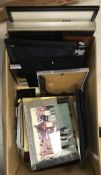 A box of various modern photograph frames and a box of various sundry items including table lighter,