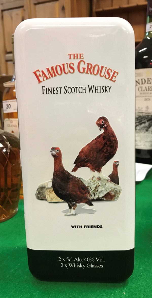 A box containing a Famous Grouse presentation set of two glasses and two miniature bottles together