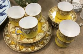 A Royal Worcester part tea set decorated with floral sprays on a yellow ground,