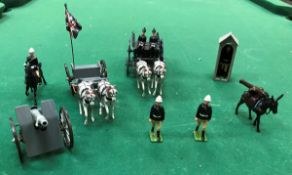 A box containing a collection of various Britains painted figures including artillery gun carriage,