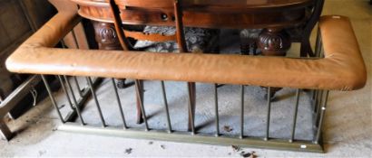 An early 20th Century club fender with upholstered seat and brass suppports