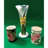 A Wemyss stem vase with pinched top, decorated with Daffodils, stamped and signed "Wemyss" to base,