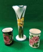 A Wemyss stem vase with pinched top, decorated with Daffodils, stamped and signed "Wemyss" to base,