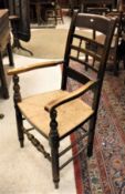 A set of six Provincial French rush seated spindle back chairs together with two similar carvers