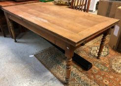 An elm extending farmhouse kitchen table raised on ringed and turned legs CONDITION