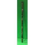 A 20th Century Papua New Guinea mother of pearl inlaid ebony ceremonial walking stick with figural