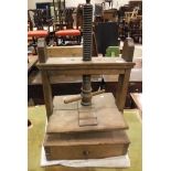 A 19th Century oak table top book press