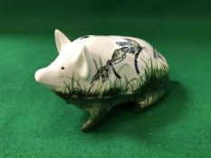 A Griselda Hill pottery model pig decorated with dragonflies,