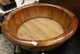 A Chinese elm bowl of large proportions with brass coopering