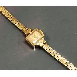 A ladies Rotary 9 carat gold cased wristwatch with 9 carat gold flat link bracelet