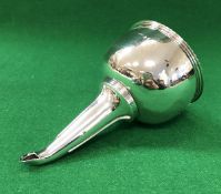 A late George III silver wine funnel with egg and dart decorated rim and pierced strainer (by