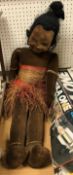 A Norah Wellings brown velvet covered "Island girl" in grass skirted dress and bead necklace and