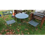 A metal two seat bistro set together with a pine wall mounted plate rack and a set of brass balance