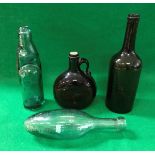 A 19th Century green glass bottle, together with a reddy brown spirit decanter,