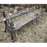 An early 20th Century wrought iron and slatted wooden three piece garden suite,