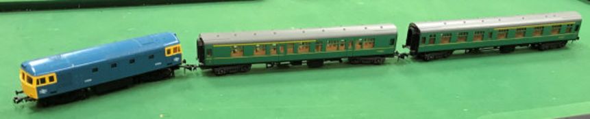 A Lima O gauge British Rail diesel loco together with five Lima carriages