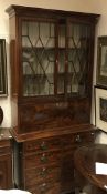 A Victorian mahogany and inlaid bureau bookcase cabinet,