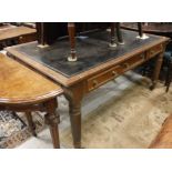 A 19th Century mahogany library table with tooled leather writing surface over three frieze drawers