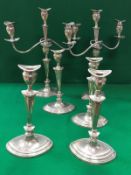 A set of six Edwardian silver table candlesticks of navette form,