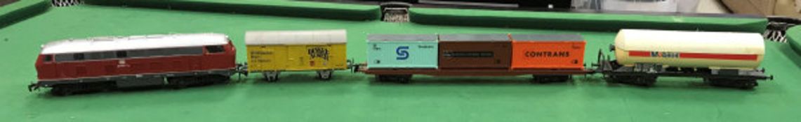 A Rivarossi O gauge diesel locomotive, various rolling stock including Lima Mobil Oil fuel tanker,