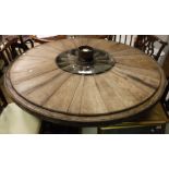 A hand made oak centre table constructed from wooden cartwheel with central nut inscribed "CH.