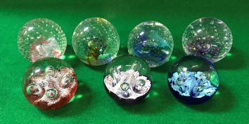 A collection of seven Caithness paperweights comprising "Reflections 91", "Reflections 93",