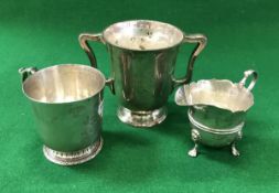 An Edwardian Scottish silver loving mug of inverted bell form with open handles,