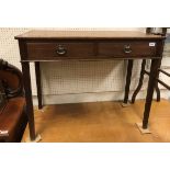 A 19th Century oak side table the plain top above two drawers raised on square tapering legs