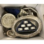 A box of various plated wares to include six napkin rings, rose bowl, tureen, cruets, cream jugs,