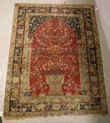 A Persian prayer rug, the central panel set with tree with bird decoration on a red and blue ground,