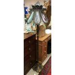 A Tiffany style leaded glazed standard lamp with matching table lamp and a further similar table