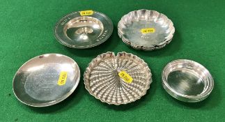 A collection of eleven small silver dishes, 24.