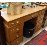 A modern pine double pedestal desk