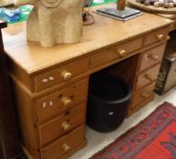 A modern pine double pedestal desk