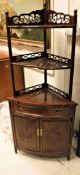 A Chinese hardwood corner cabinet with open shelving,