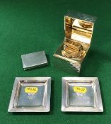 An Asprey sterling silver cased table cigarette lighter of cube form with sunburst design,