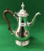 A George III silver baluster shaped coffee pot with acanthus decorated spout,