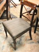 A set of six Victorian mahogany bar back dining chairs with X backs and upholstered seats on turned