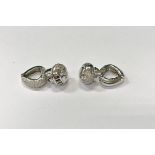 A pair of 14 carat white gold and diamond earrings, 10.